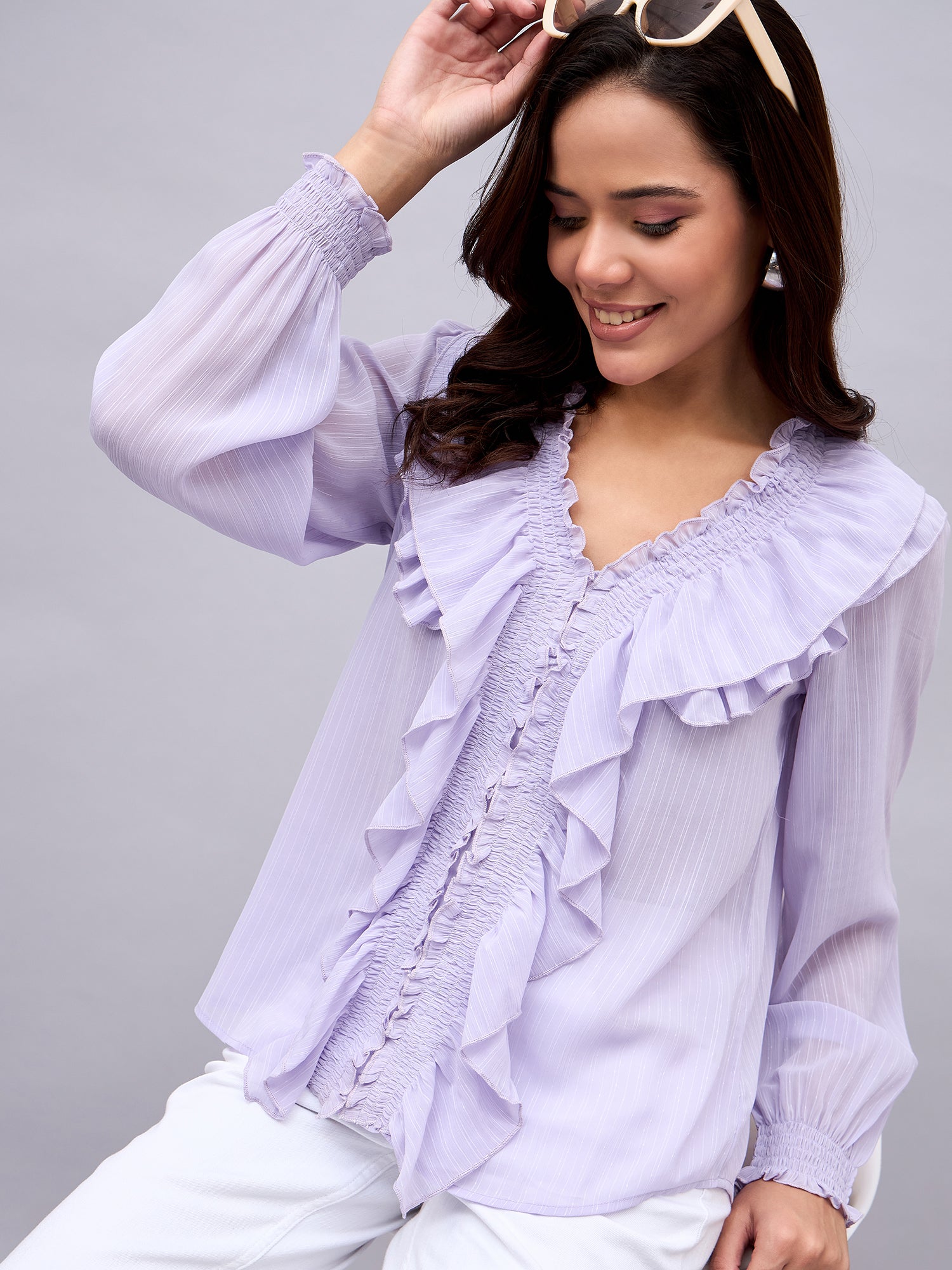Model wearing lavender ruffle top by NUWAH – front view

