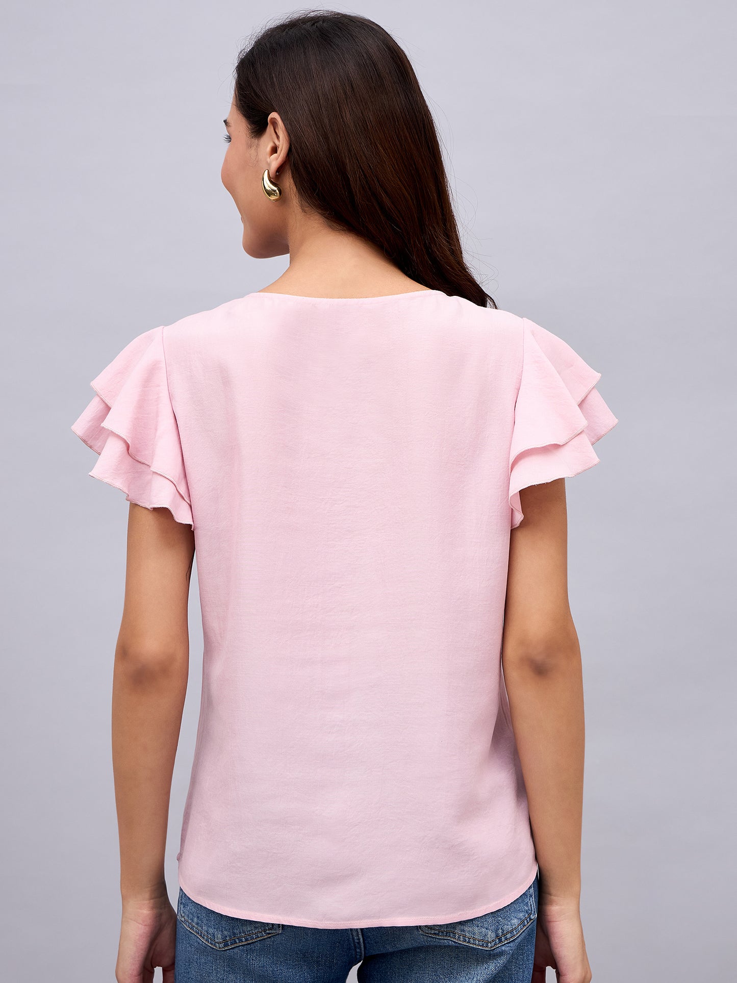 Back view of NUWAH pink ruffle sleeve  top – relaxed fit
