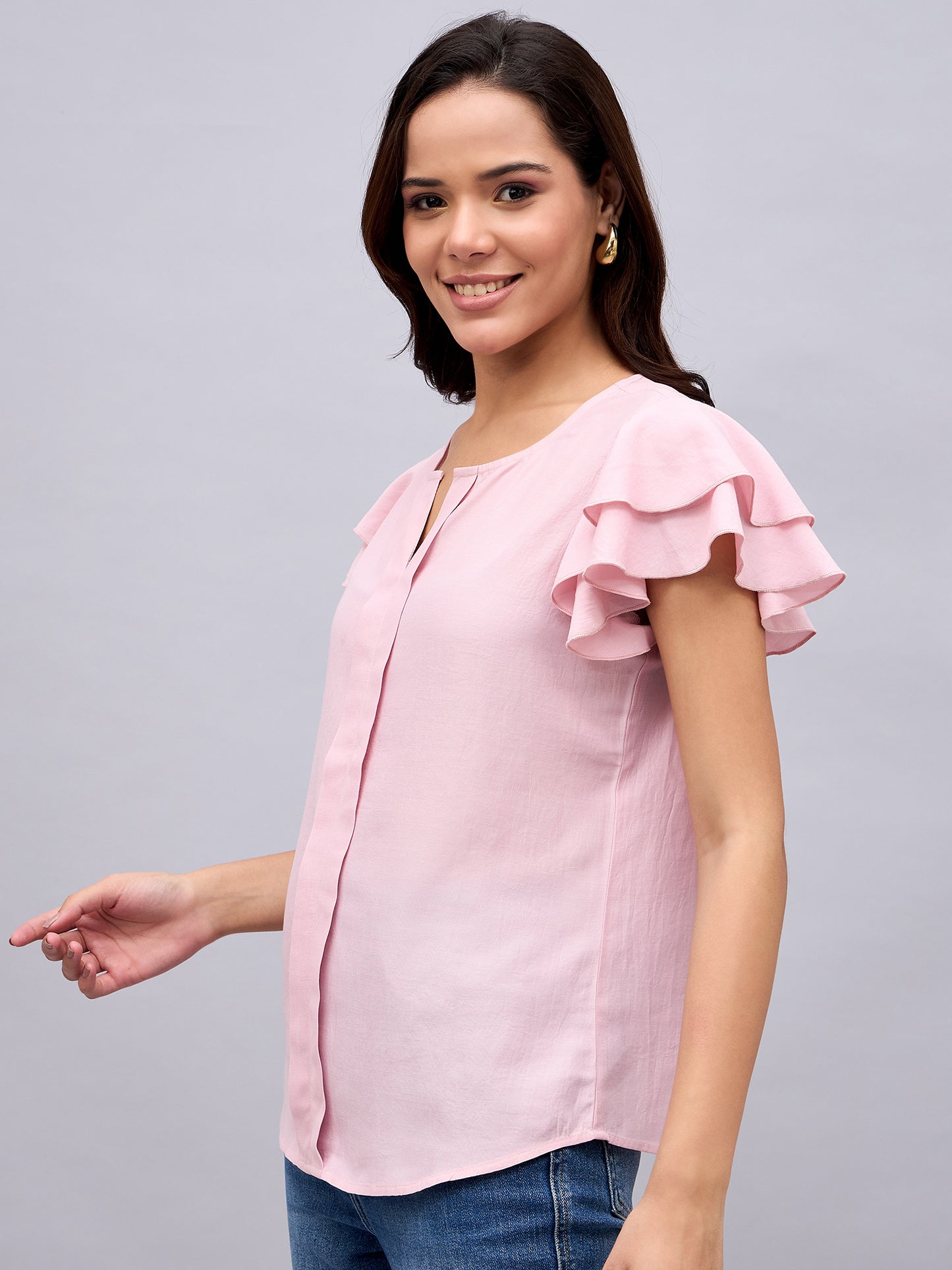 Side profile of NUWAH pink  top with double ruffle sleeves
