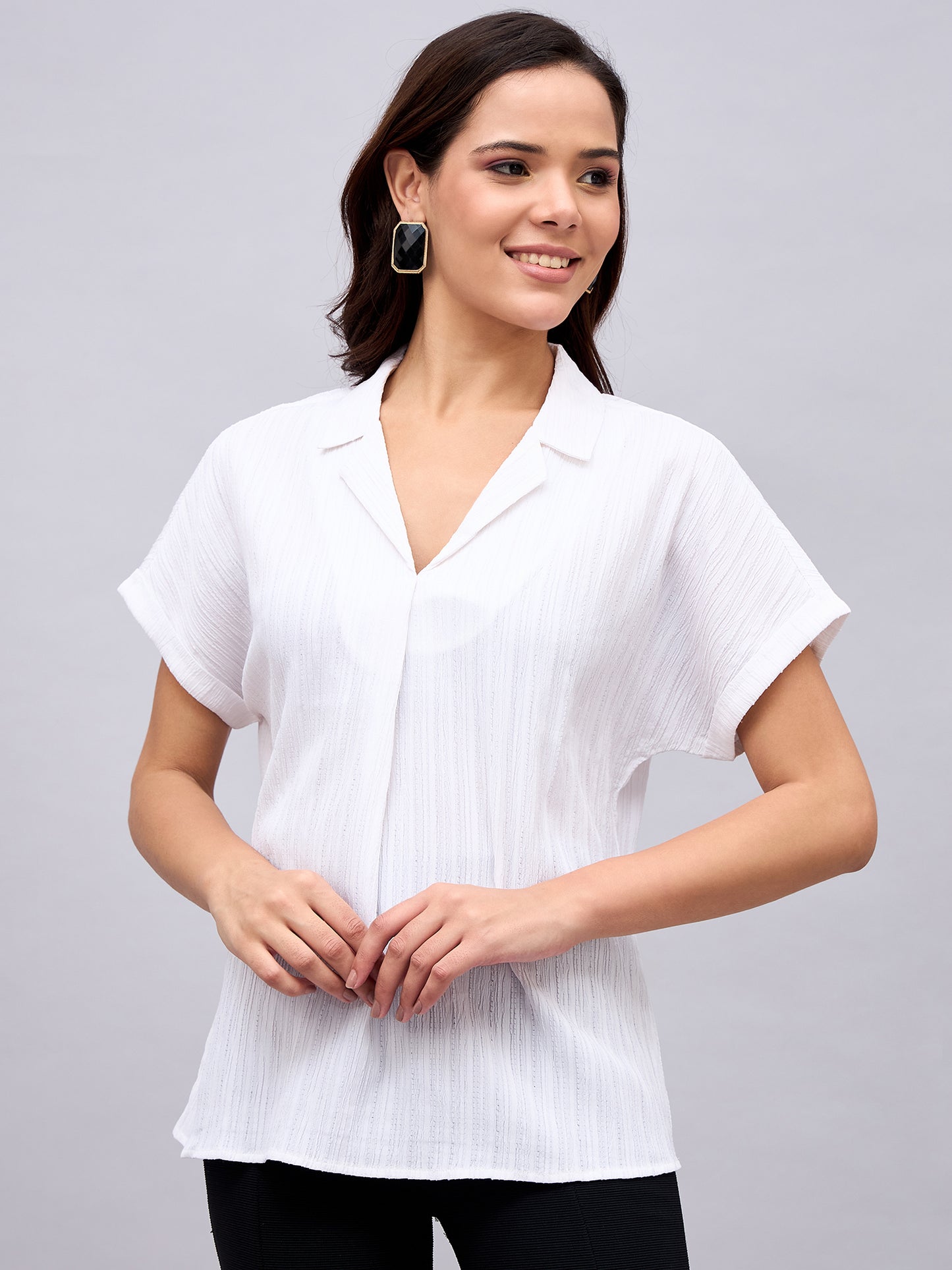Model wearing white textured Cuban collar top – NUWAH front view
