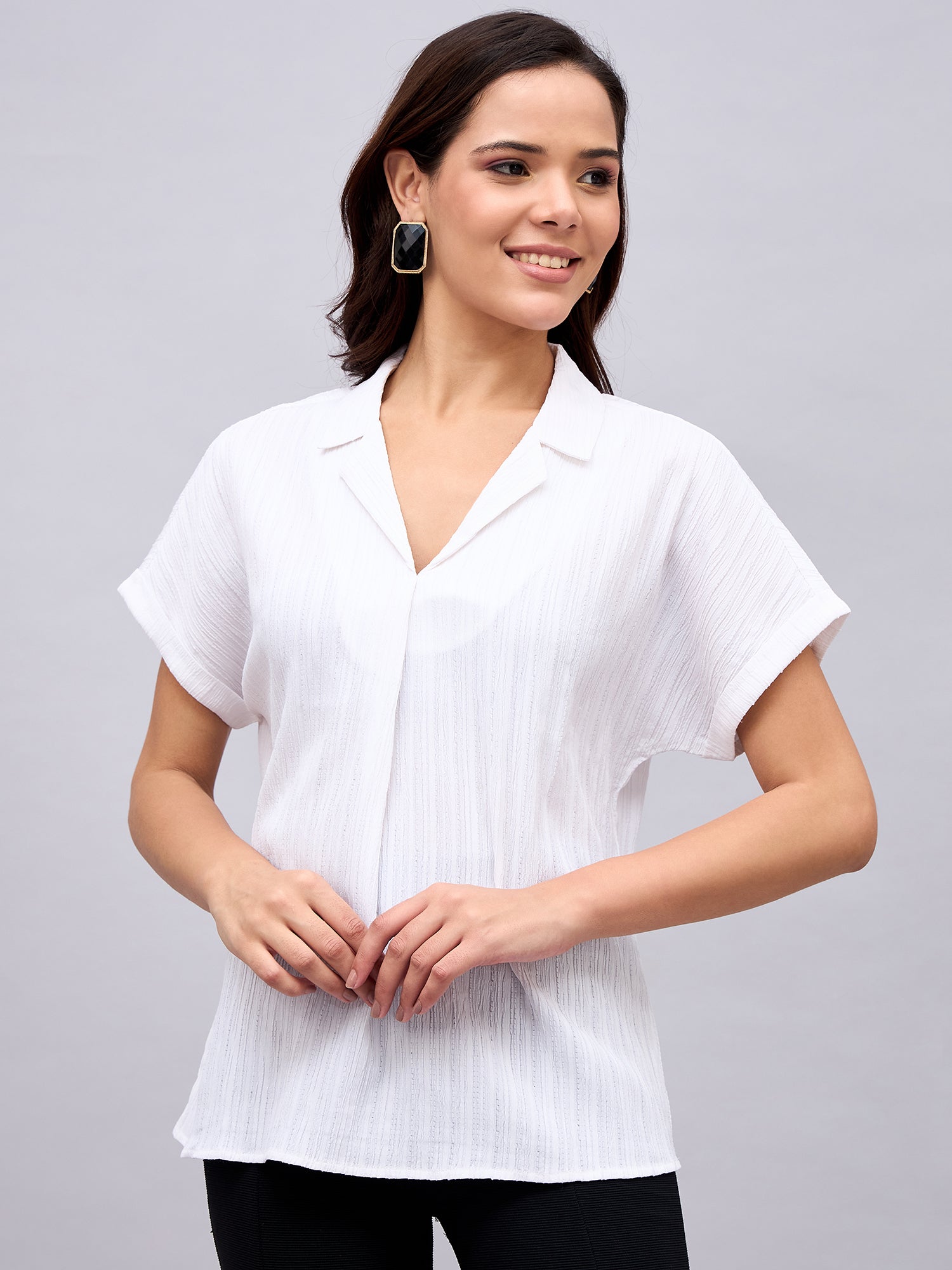 Model wearing white textured Cuban collar top – NUWAH front view
